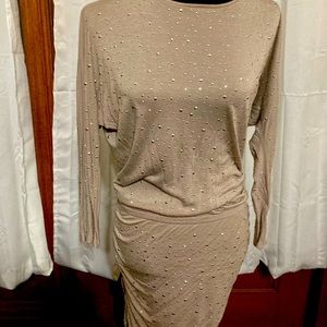 Women’s party dresss, metallic embellish all over, draped sides.